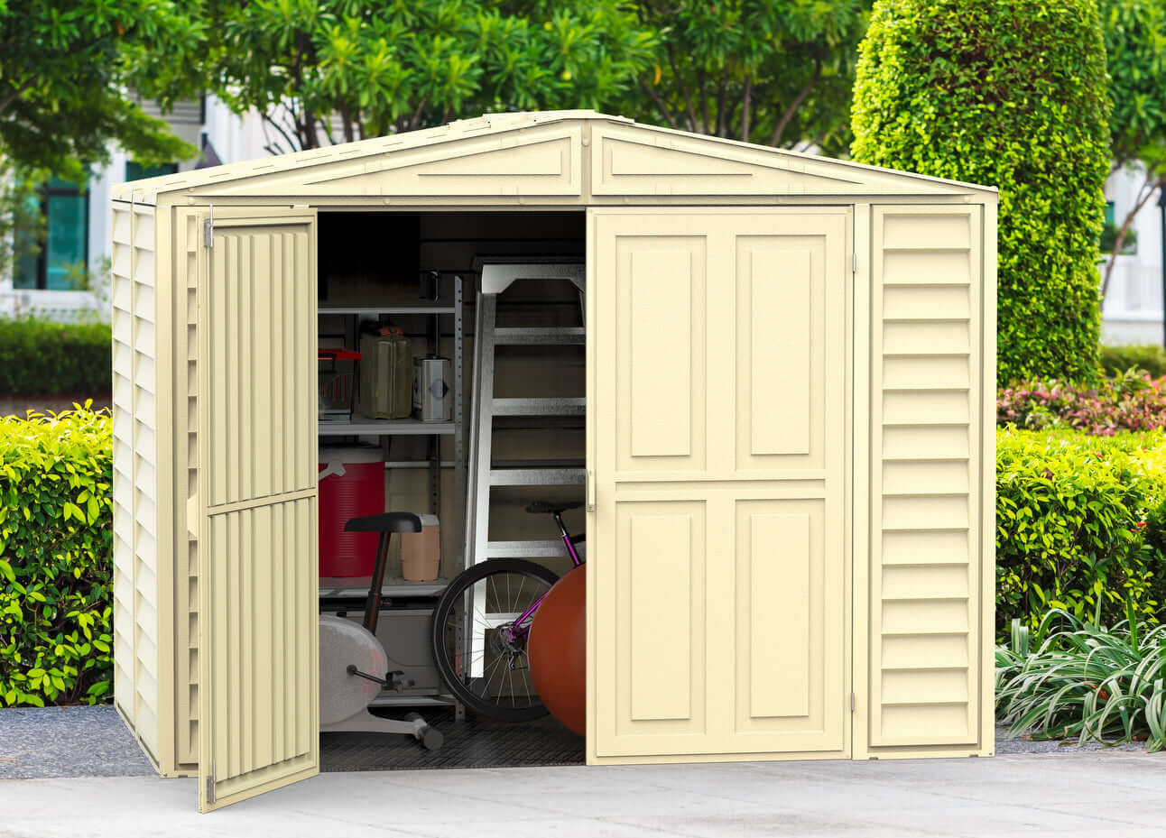 Duramax 8' x 5.3' DuraMate Shed with Foundation Kit 00184 shed in yard with door open filled with contents