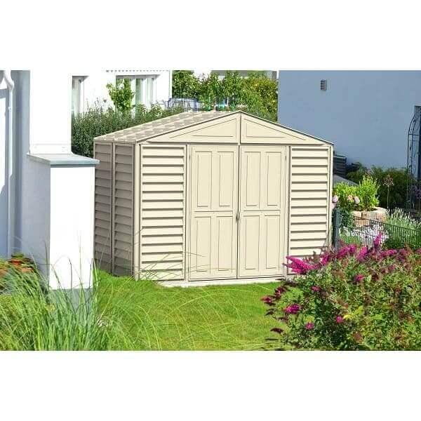 Duramax 10.5’ x 5.0’ Woodbridge with Foundation 00283 shed in yard next to house